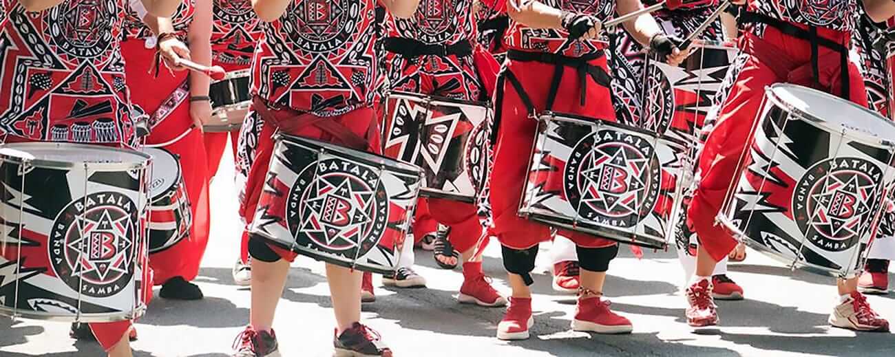 Batala drummers wearing drums - close up on legs and drums